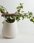 Handmade Porcelain Vase with Wooden Detail – White Smooth Surface (15×20 cm.)